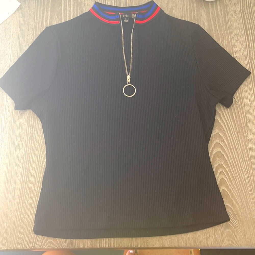 Black t-shirt, with blue and red lines on the top